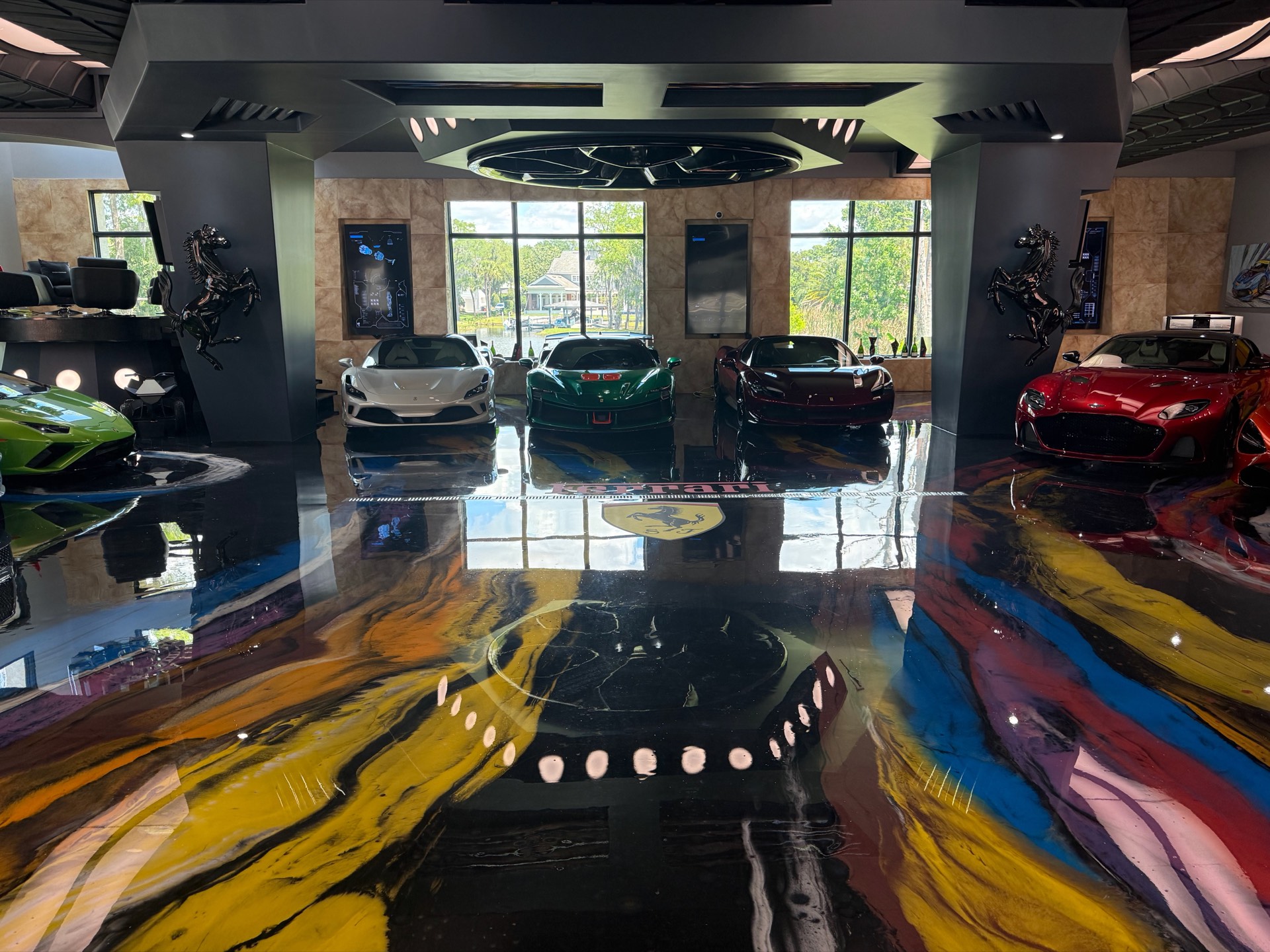 Custom metallic epoxy floor in a luxury car showroom by Phoenix Concrete Coatings
